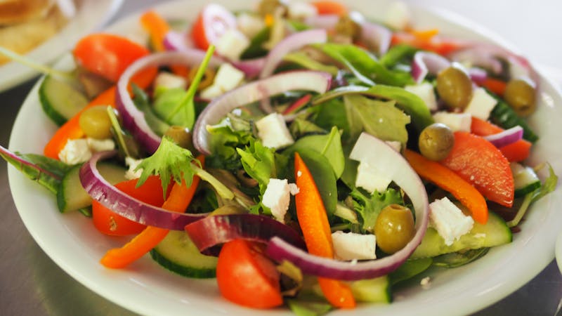 Italian salad with olives, pepperoncini and mixed greens