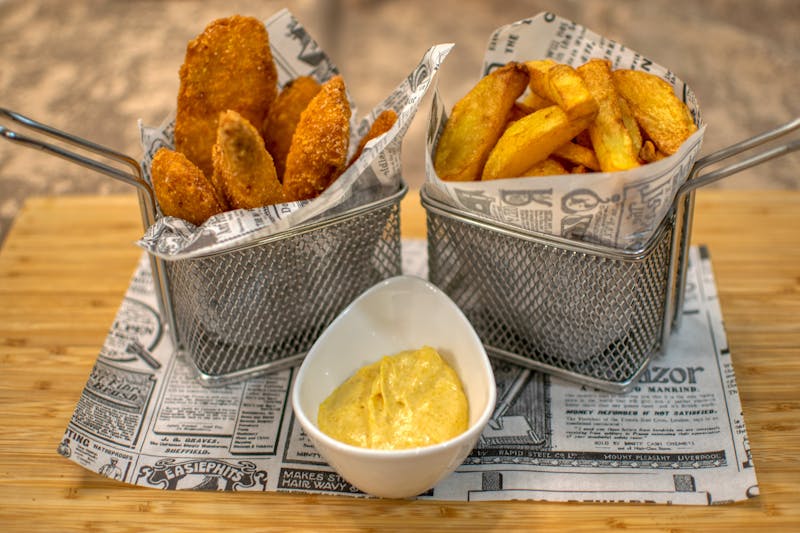Crispy seasoned fries with dipping sauce
